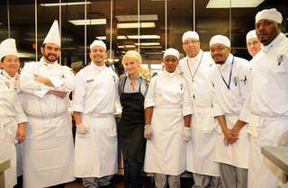 Holly Madison and culinary students serve a Thanksgiving lunch to at-risk students and senior citizens at Le Cordon Bleu College of Culinary Arts on Nov. 24, 2009.