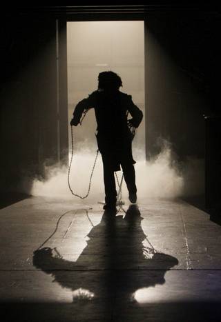Ebenezer Scrooge is visited on Christmas Eve by the ghost of his former partner Jacob Marley during a dress rehearsal of 