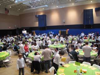 Volunteers and needy Las Vegans gather in the gym of Calvary Chapel Spring Valley to share a Thanksgiving meal. About 1,600 people were served by the chapel this year, receiving food, clothing, showers and other services. 