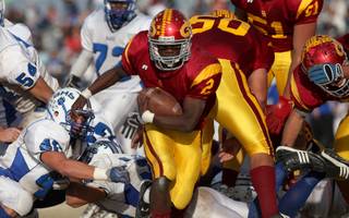 Del Sol High's Chris Marshall breaks through the Basic defensive line Saturday during the Sunrise Regional championship game. Del Sol won 20-19.