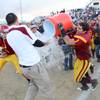 Del Sol High senior tight end Daniel Doph throws water on Dragons' coach Preston Goroff to celebrate a Sunrise Regional championship game victory against Basic. Del Sol High senior tight end Daniel Doph throws water on Dragons' coach Preston Goroff to celebrate a Sunrise Regional championship game victory against Basic.