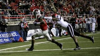 UNLV receiver Phillip Payne beats Dey Juan Hemmings of San Diego State for a touchdown during the season finale for both teams Saturday at Sam Boyd Stadium. UNLV won the game 24-20.