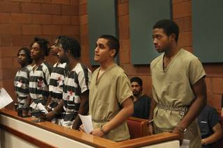 Defendants (from right) Prentice Marshall, 18; Adrian Pena, 17; Saul Williams Jr., 20; Emmitt Ferguson, 18; Michael Ferguson, 25; and Quadrae Scott, 18, appear for arraignment before Justice of the Peace Stephen J. Dahl on Dec. 2, 2009. They are facing charges in connection with the murder of Metro Police Officer Trevor Nettleton, who was fatally shot in his garage Nov. 19 during what police have called an attempted robbery.