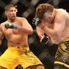 Brendan Schaub (left) and Roy Nelson fight during the main event of the Ultimate Fighter Championship Saturday night at the Palms.   Nelson won the fight and the six-figure contract with the UFC.