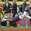 Photo: Arizona wide receiver Juron Criner, right, dives i
