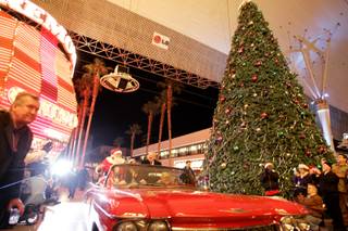 Mayor Oscar Goodman and Santa Claus ride inside a classic Cadillac Eldorado into the Fremont Street Experience to perform the Christmas tree lighting ceremony in downtown Las Vegas on Dec. 8, 2009.