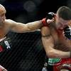 B.J. Penn lands a left hook to Diego Sanchez during their lightweight championship fight at FedEx Forum in Memphis, Tenn., on Dec. 12, 2009. Penn ended up winning the fight by TKO in the final round.