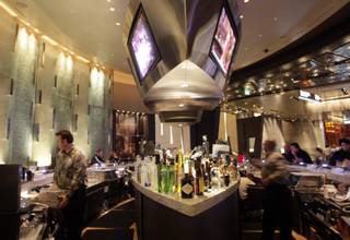 Employees ready the bar at the Skybox Bar at Aria, the centerpiece of the $8.5 billion CityCenter project, Monday, December 14, 2009. 