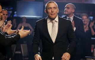 MMA fighter Georges St-Pierre walks toward the stage to accept the Fighter of the Year award during the Fighters Only World Mixed Martial Arts Awards 2009 at The Joint inside the Hard Rock Hotel.