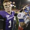 TCU quarterback Andy Dalton, left, pats the helmet of Boise State quarterback Kellen Moore following the Broncos' 17-10 victory over the Horned Frogs in the Fiesta Bowl in January. TCU quarterback Andy Dalton, left, pats the helmet of Boise State quarterback Kellen Moore following the Broncos' 17-10 victory over the Horned Frogs in the Fiesta Bowl in January.
