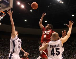 UNLV guard Oscar Bellfield shoots a runner against BYU on Wednesday at the Marriott Center in Provo, Utah.