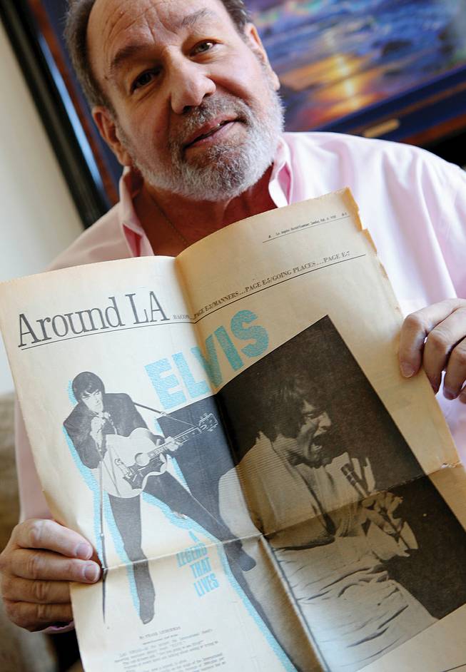 Longtime Las Vegas journalist Frank Lieberman holds a printed copy of his interview with Elvis, which appeared in the <em>Los Angeles Herald-Examiner</em> on Feb. 8, 1970. 