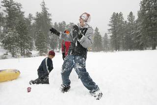 Austin Moncrief reacts to being hit with a snowball while taking advantage of the Martin Luther King holiday to play with friends in the snow in Lee Canyon Monday, January 18, 2010.