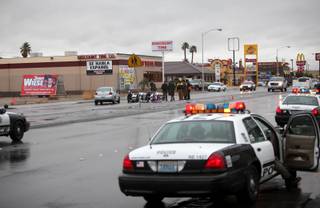 Metro Police investigate a collision involving two motorcycle police officers at the intersection of Nellis Boulevard and Harris Avenue Thursday, Jan. 21.