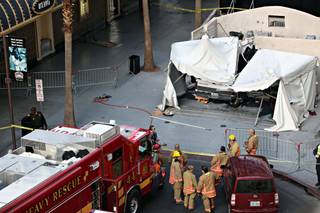 Emergency personnel respond to a crash at the Fremont Street Experience in downtown Las Vegas on Tuesday, Jan. 26, 2010. 