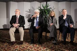 Boulder City council members Duncan McCoy, from left, Travis Chandler, Linda Strickland and Cam Walker sit next to the podium as Mayor Roger Tobler prepares to deliver the annual State of the City Address in the pavilion at Boulder Creek Golf Club in Boulder City Thursday, January 28, 2010.
