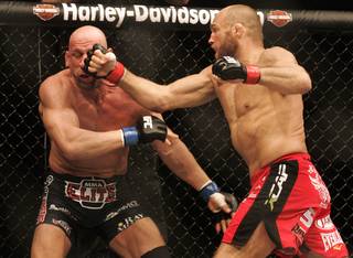Randy Couture tags Mark Coleman with a right during their light heavyweight bout at UFC 109 Saturday, Feb. 6, 2010, at the Mandalay Bay Events Center. Couture won the battle of UFC Hall of Fame fighters by submission in the second round.