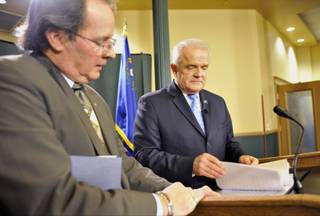 Gov. Jim Gibbons looks over his speech with Dan Burns, his communications director, as the governor prepares to give his state of the state speech upstairs in the Capitol building in Carson City on Monday, Feb., 8, 2010. 
