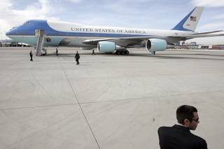 Secret Service await President Barack Obama with Air Force One at McCarran International Airport in Las Vegas Friday, February 19, 2010.