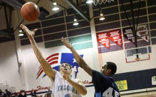 Dakota Yamka of Foothill High scores two points on Friday night during the Sunrise Regional championship game against Canyon Springs. Yamka finished with seven points off the bench, but the Falcons lost 76-60. 
