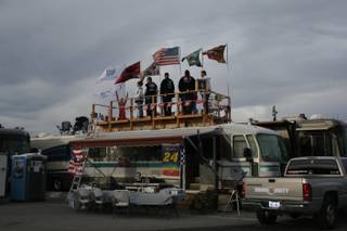 Sam Schlientz and his tailgating crew watch Friday's qualifying runs from a wooden deck they built three years ago.
