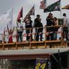 Sam Schlientz and his tailgating crew watch Friday's qualifying runs from a wooden deck they built three years ago.