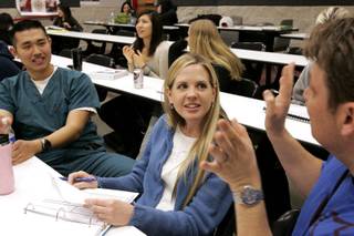 Senior nursing students Johnny Chu, from left, Natasha Tomaszewski and Jamie Mullis chat during a break in Medical/Surgical Nursing class inside the Bigelow Health Sciences building on the campus of UNLV in Las Vegas Monday, March 1, 2010.