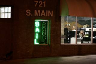 Bail agent Jody Sandoval talks on the phone during the swing shift at Black Jack Bail Bonds in downtown Las Vegas Wednesday, March 3, 2010.