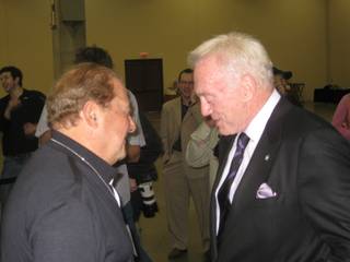 Bob Arum and Jerry Jones, in conference.