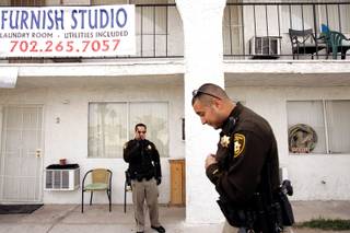 Officer Erik Janecek, left, and Officer Rico Rodriquez of Metro's Downtown Area Command unit check on a welfare call in downtown Las Vegas Friday, March 5, 2010. 