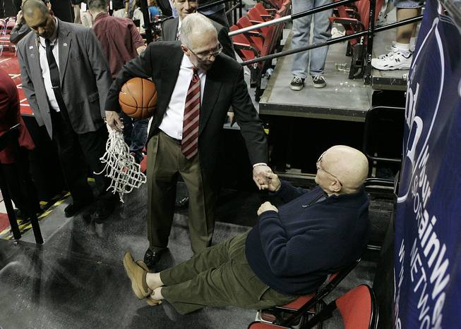 San Diego State coach Steve Fisher takes a moment to talk with former UNLV coach Jerry Tarkanian after the Aztecs beat the Rebels 55-45 in the Mountain West Conference championship game Saturday, March 13, 2010, at the Thomas & Mack Center.