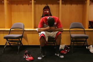 UNLV guard Justin Hawkins puts his head in his hands after the Rebels lost to UNI Thursday in the first round of the NCAA Tournament at the Ford Center in Oklahoma City. UNI won the game 69-66 on a last-second 3-point shot.