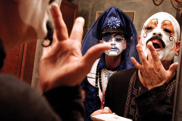 Daniel Roybal, right, puts on the makeup to become Sister Gloria-Areola All Over Glutony as Tracy Skinner, left, dressed as Mother Loosy Lust Bea Lady looks on as they prepare for an event at a friend's house hosted by the Sin City Sisters of Perpetual Indulgence at the Funhog Ranch in Las Vegas Saturday, March 20, 2010.