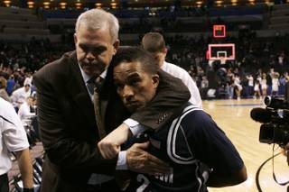 BYU head coach Dave Rose walks off the court with senior guard Lamont Morgan, Jr. after BYU lost to Kansas State 84-72 in their second round NCAA Basketball Tournament game Saturday, March 20, 2010 at the Ford Center in Oklahoma Ctiy. 