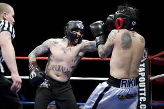 Benji Madden boxes MTV VJ Riki Rachtman during Ellis Mania 5 at The Joint in the Hard Rock Hotel on April 3, 2010.