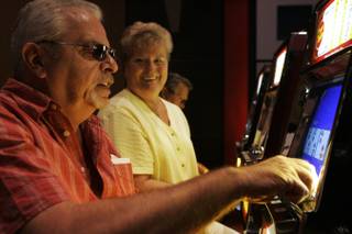 Jerry and Patsy Hale play video poker in the coin slot area at Eastside Cannery Thursday, April 15, 2010.
