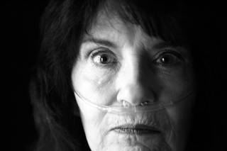 Julie Rich contracted MRSA, a bacterial infection resistant to antibiotics, after undergoing an outpatient procedure at a local hospital in May 2005. Her body was disabled by the infection and she now lives on oxygen. Rich was photographed in her Las Vegas home April 20, 2010.