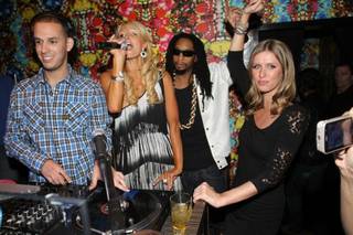 DJ Eric DLux, Paris Hilton, Lil Jon and Nicky Hilton at Vanity in the Hard Rock Hotel on April 24, 2010.
