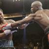 Shane Mosley (L) takes a punch from Floyd Mayweather Jr. during their welterweight fight Saturday at the MGM Grand Garden Arena.