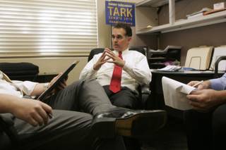 Policy director Ben Stecker (L) and volunteer Dean Stump help Danny Tarkanian prep for a Republican debate Friday, April 30, 2010.