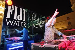 Chef Hubert Keller spins in the Fiji Water DJ Booth at the Vegas Uncork'd Grand Tasting at Garden of the Gods in Caesars Palace on May 7, 2010.