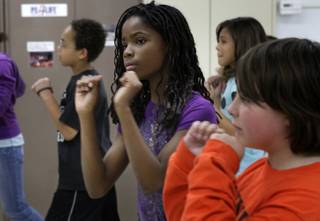 Fifth grader Ruby Payne, center, dances with classmates at  Gilbert Elementary School Wednesday, May 12, 2010. Gilbert, a magnet school for communication and creative arts, was recently named the top magnet school in the country.