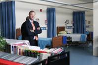 Steve Hill, seen here when he was chairman of the Las Vegas Chamber of Commerce's Policy Task Force, studies the textbooks in the Respiratory Therapy center while touring the Health and Science building on the campus of Southwest Career & Technical Academy.