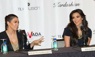 Kourtney Kardashian and Kim Kardashian announce their retail store Kardashian Khaos during a news conference at The Mirage on June 28, 2010.
