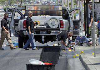 Investigators gather evidence from a truck on Sahara Avenue near Decatur Boulevard Tuesday, June 29, 2010. The Las Vegas Fire and Rescue Bomb Squad was called when a suspicious device was found in the vehicle, Metro Police said. The device was rendered safe with the assistance of bomb squad robots, they said.