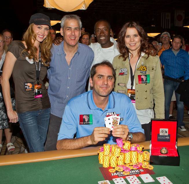 Tournament runner-up Shannon Elizabeth, Norman Epstein, Don Cheadle, Annie Duke and champion Phil Gordon, seated, at Ante Up for Africa at The Rio on July 2, 2010.