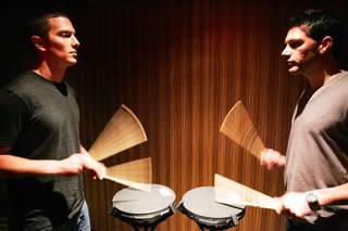 Aaron Barker, left, of Las Vegas auditions with Blue Man Scott Kinworthy during the drumming section of open auditions for the Blue Man Group on Monday inside the Venetian.