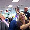 Zappos culture guide Jon Wolske - how many companies have that position? - and fellow Zappos employees welcome a tour group last week with a choreographed weight-lifting routine to the tune of "Eye of the Tiger" in the Zappos office building in Henderson. Zappos departments regularly compete for the best tour-welcoming cheer or performance.
