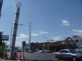 The 45-foot brushes straddled the entrance to the Arts District on Charleston Boulevard.