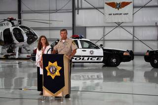 Sheriff Doug Gillespie speaks to the media about a new campaign to get officers to drive safely while Vanessa Maniago, left, vice president of strategic development for R & R Partners, which helped with the campaign, listens.